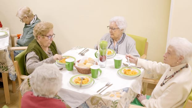 Top view of people eating in nursing home