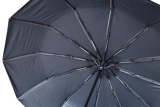 The inside of black umbrella with spokes