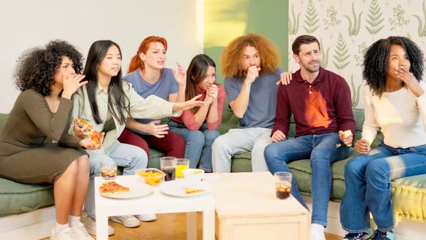 Group of friends at home watching a game on TV. Maximum tension