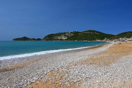Beautiful beach with sea, sun and blue sky. Concept for travel and summer vacation. Greece-island of Corfu. Agios Georgios beach