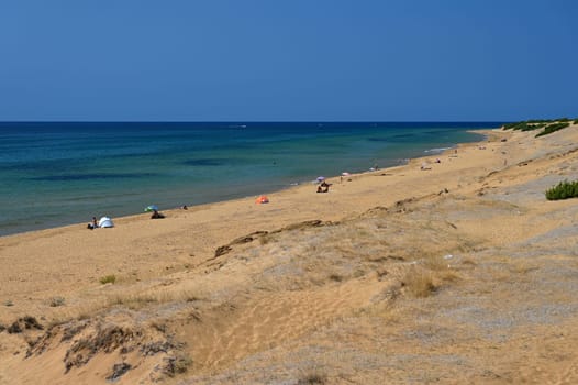 Beautiful beach with sea, sun and blue sky. Concept for travel and summer vacation. Greece-island of Corfu.