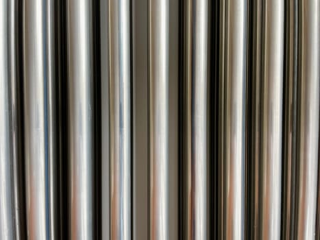 Silver background of corrugated metal seamless pipe. High quality photo
