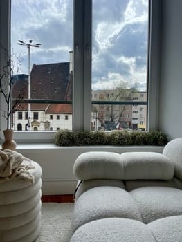 Part of the decoration in the interior, a vase and a view of the city from the window. High quality photo
