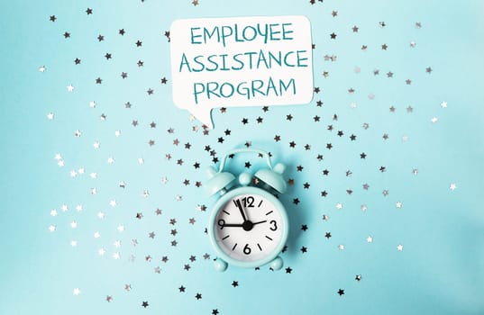 A clock with the words Employee Assistance Program written above it. The clock is on a blue background with a lot of stars