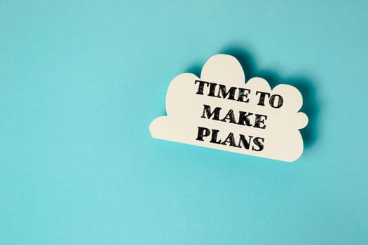 A cloud with the words "Time to make plans" written on it. Concept of urgency and the importance of taking action