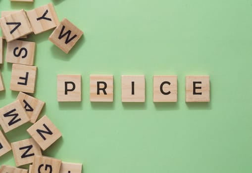 A jumble of wooden letters spell out the word price. The letters are scattered across the image, with some overlapping each other. Scene is playful and whimsical, as if the letters have come to life