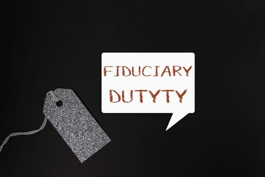 A tag with the word fiduciary on it is hanging from a chain. The tag is on a black background