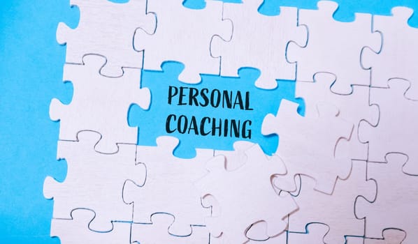 A puzzle with the word personal coaching written in the middle. The puzzle is incomplete, with a piece missing