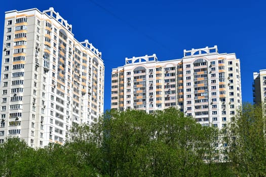 City houses surrounded by trees in the Moscow, Russia