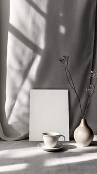 Serene still life setup featuring a coffee cup and vase in soft natural light, ideal for branding mockups