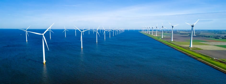A picturesque scene of numerous windmills scattered across a vast body of water, set against a clear, spring day in Flevoland, Netherlands. windmill turbines green energy in the ocean