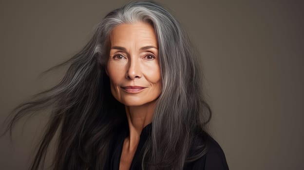 Elegant, elderly, chic Latino, Spain woman with gray long hair and perfect skin, on a brown background, banner. Advertising of cosmetic products, spa treatments, shampoos and hair care products, dentistry and medicine, perfumes and cosmetology women