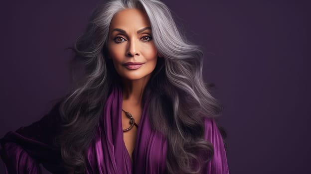 Elegant, elderly, chic latino, Spain woman with gray long hair and perfect skin, purple background, banner. Advertising of cosmetic products, spa treatments, shampoos and hair care products, dentistry and medicine, perfumes and cosmetology for women
