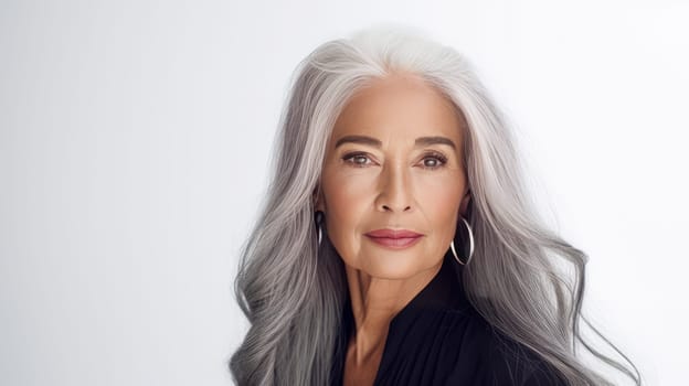 Elegant, elderly, chic Latino, Spain woman with gray long hair and perfect skin, white background, banner. Advertising of cosmetic products, spa treatments, shampoos and hair care products, dentistry and medicine, perfumes and cosmetology for women