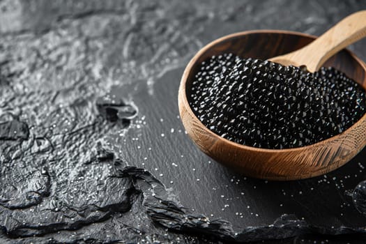 Exquisite black sturgeon caviar presented in wooden bowl on dark, textured stone surface sprinkled with salt. Concept of luxury, gourmet delicacy, and fine dining.