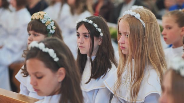 Children in a Catholic church during their first communion
