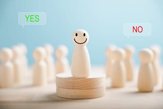 Wooden peg dolls on cube show yes or no symbols. Illustrates open-mindedness in elections with volunteers candidates and electorates. Think With Yes Or No Choice.