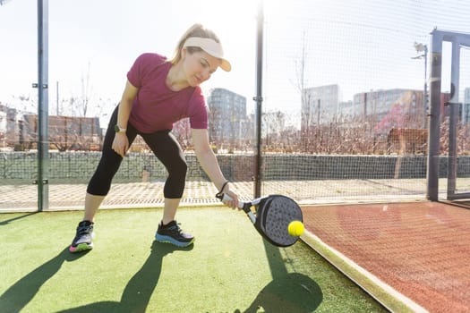 One women playing Paddle tennis. High quality photo