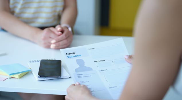 HR manager keeps resume at workplace. Recruiting staff concept