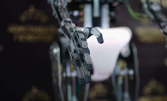 Robot stretching out metal hand for handshake closeup. Modern technologies concept