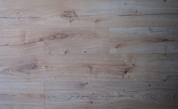 Natural durable beige brown wood laminate. Choice of flooring concept