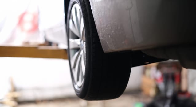 Closeup of rubber tires on car wheel. Auto tire service concept