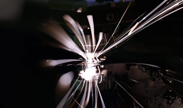 Hot sparks at grinding steel material. Sparks of welding concept