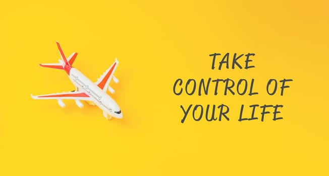 A small airplane is on a yellow background with the words Take control of your life written below it