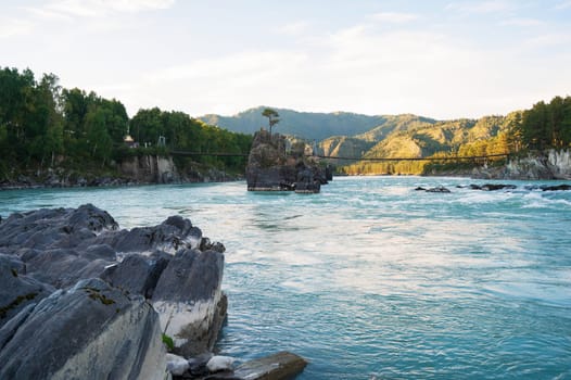 Fast mountain river Katun in Altay, Siberia, Russia. A popular tourist place called the Dragon's Teeth