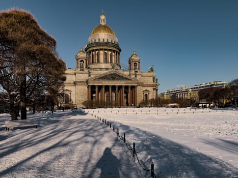 Snow-covered Park in front of St. Isaac's Cathedral in St. Petersburg - Russia in the spring sun. High quality photo