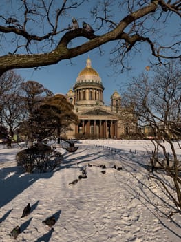 Snow-covered Park in front of St. Isaac's Cathedral in St. Petersburg - Russia in the spring sun. High quality photo