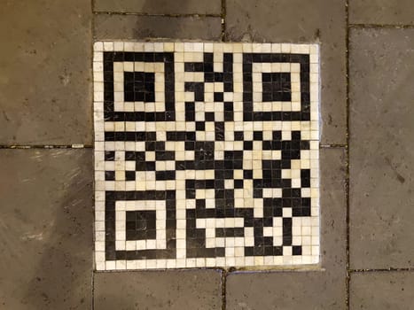 Eskesehir, Turkey - November 23, 2022: mosaic quar code on the pedestrian sidewalk, city street decor