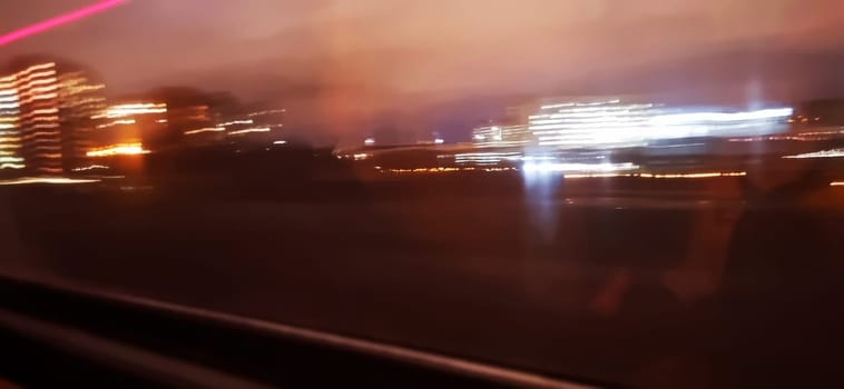 Conceptual shot of the light trails captured from the window of the moving train