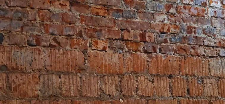 Close up shot of the wall made of old bricks