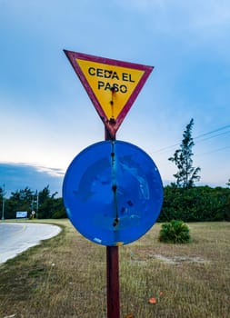 Shot of the very old road signs with give way words in Spanish