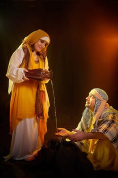 A couple in love or a married couple in stylized Eastern clothing from Israel, Palestine, Iran, Pakistan together. Tender photo session in the style of the Middle East and the Bible