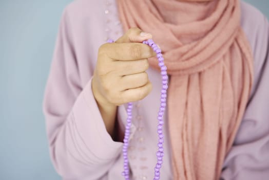 Close up of muslim women hand praying at ramadan .