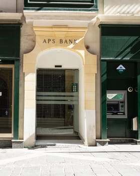 Valletta, Malta, April 03, 2024. External view of the APS Bank branch entrance in the city center