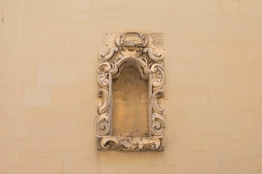 Valletta, Malta, April 03, 2024. an ancient niche decorated on a wall of a house in the historic center of the city