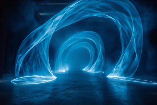 A blue wave of light is projected onto a dark background. Concept of movement and energy, as if the light is flowing through the air. The blue color of the wave adds a calming