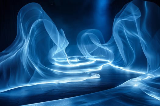 A blue wave of light is projected onto a dark background. Concept of movement and energy, as if the light is flowing through the air. The blue color of the wave adds a calming