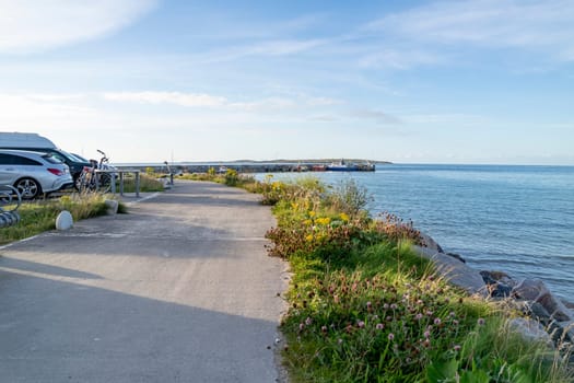 MAGHEROARTY, IRELAND - JULY 31 2022: Holiday makers enjoying the are.