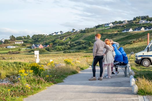 MAGHEROARTY, IRELAND - JULY 31 2022: Holiday makers enjoying the are.