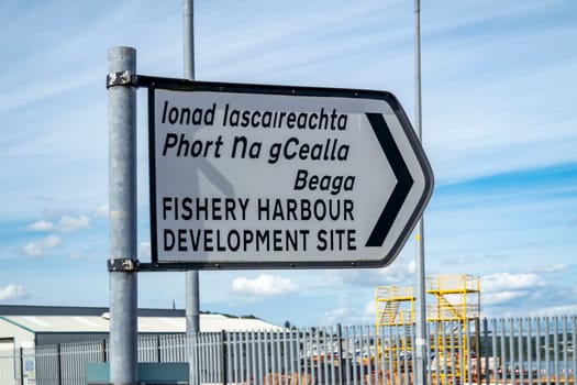 KILLYBEGS, IRELAND - MAY 16 2023: The sign at the roundabout is showing the way to the harbour.