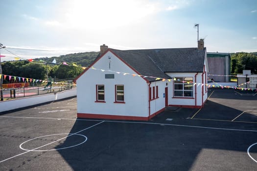 BRUCKLESS, IRELAND - MAY 16 2023: The National School is next to the church.