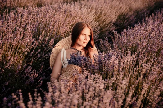 A woman is sitting in a field of lavender flowers. She is wearing a straw hat and holding a basket of flowers. The scene is peaceful and serene, with the woman enjoying the beauty of the flowers