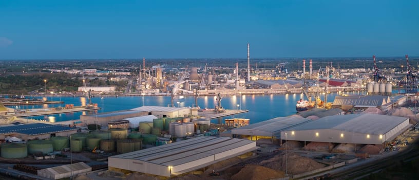 Aerial view of the industrial and port area of Ravenna ,chemical and petrochemical pole,thermoelectric,metallurgical plants and hydrocarbon refinery and liquefied natural gas tanks