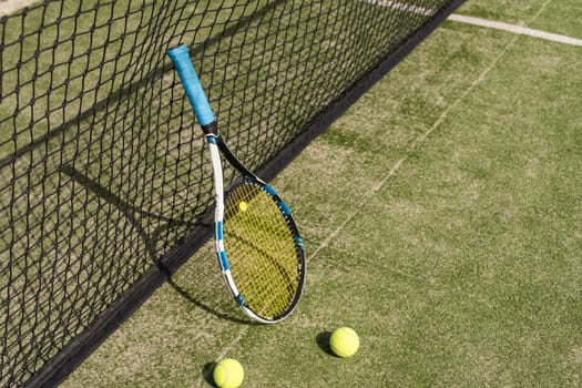Tennis racket with a set of balls. High quality photo