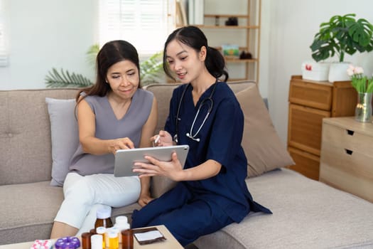 Doctor or nurse caregiver showing a prescrption or documents and holding drug bottle to senior man at home or nursing home.