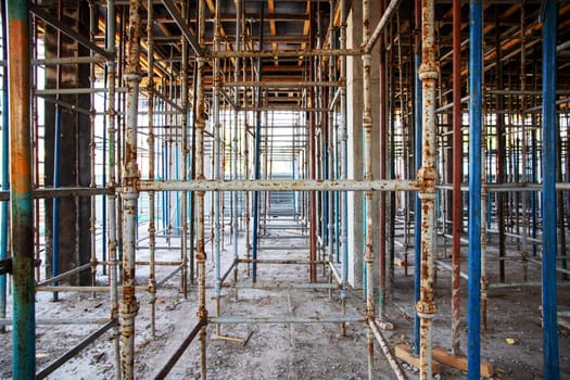 Prepared scaffolding for formwork to cover the 2nd floor for pouring reinforced concrete into a building under construction.